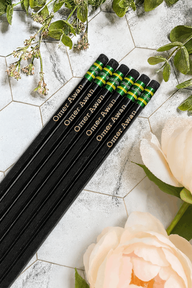 Personalized engraved pencil on notebook and desk β unique office supplies and corporate stationery gift